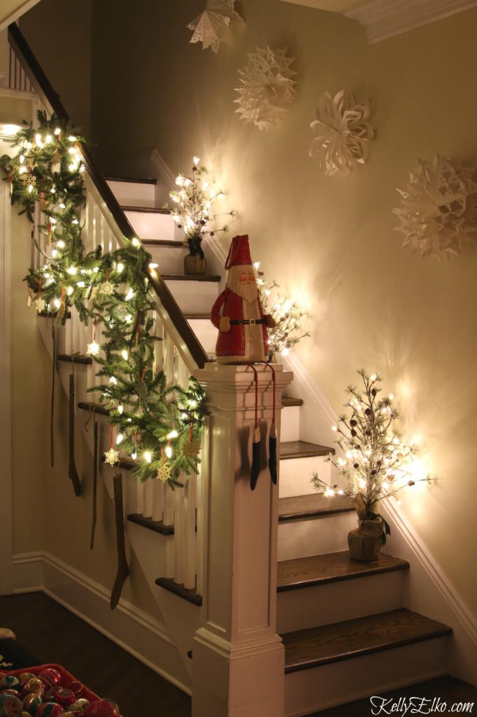 Holiday lights garland staircase banister