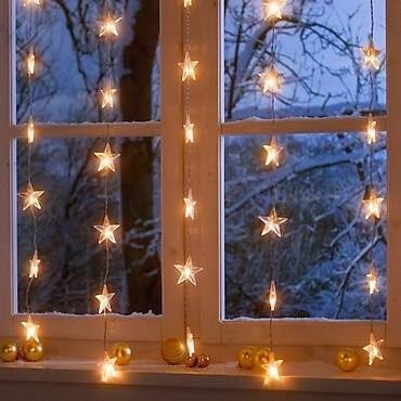 Star holiday lights in window