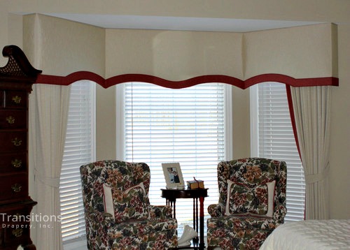 Cornice and drapes transitional bedroom